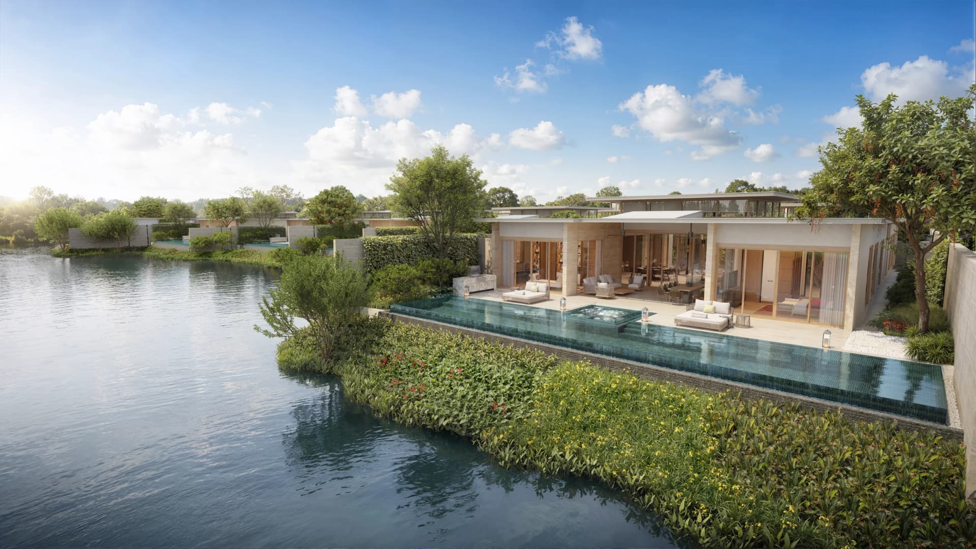 Yara lagoon villa: a single-storey house and its pool edge above the still Banyan Tree Lagoon
