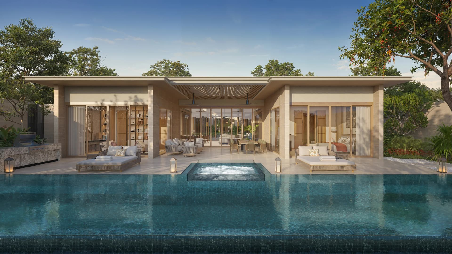 Yara collection: a long dark-tiled pool with a raised jacuzzi in front of the living pavilion